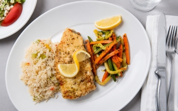 Pan-fried Halibut Steak and topped with Greek spices