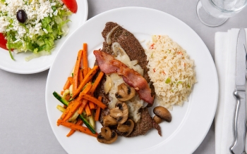Tender baby beef liver topped with carmelized onion and/or bacon and mushroom