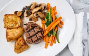 Filet Mignon Steak dinner with sides and vegetables